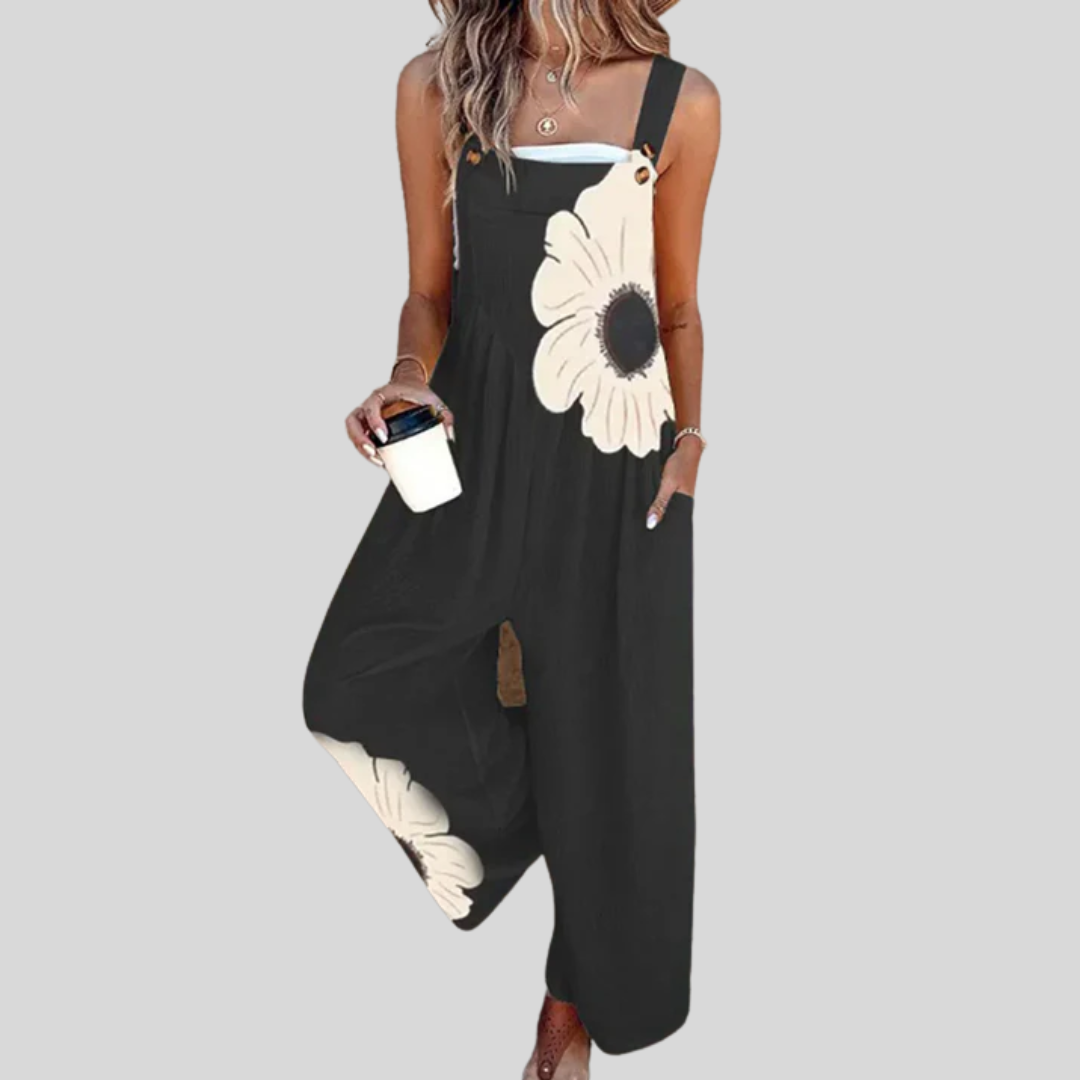Schwarze Latzhose mit großer Blüte